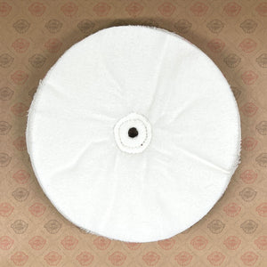 Single-stitched loose-ply buffing wheel for metal and marble polishing, with 1/2 arbor hole.