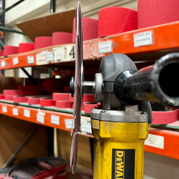 10-inch Renegade Abrasive Pinwheel for metal surface preparation, with color-coded abrasive flaps in various grits.