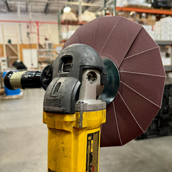 10-inch Renegade Abrasive Pinwheel with Aluminum-Oxide flaps for metal surface preparation, color-coded for easy assembly.
