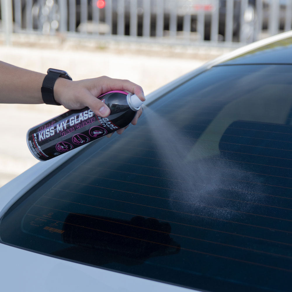 Renegade Kiss My Glass aerosol cleaner can on a counter next to a Waffle Weave Towel, ideal for streak-free glass cleaning.