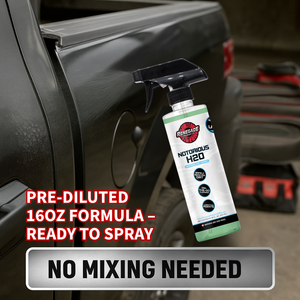 Spray bottle of renegade products Notorious H2o waterless wash on a car with text about pre-diluted formula and no mixing needed.