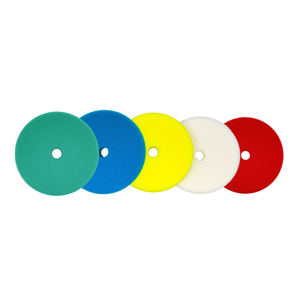 Assorted 6-inch foam polishing pads with different colors for varying degrees of abrasion, designed for metal and paint restoration.