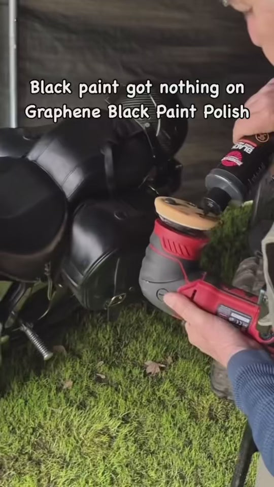 Machine-polishing a black motorcycle fuel tank with Graphene Black Paint Polish