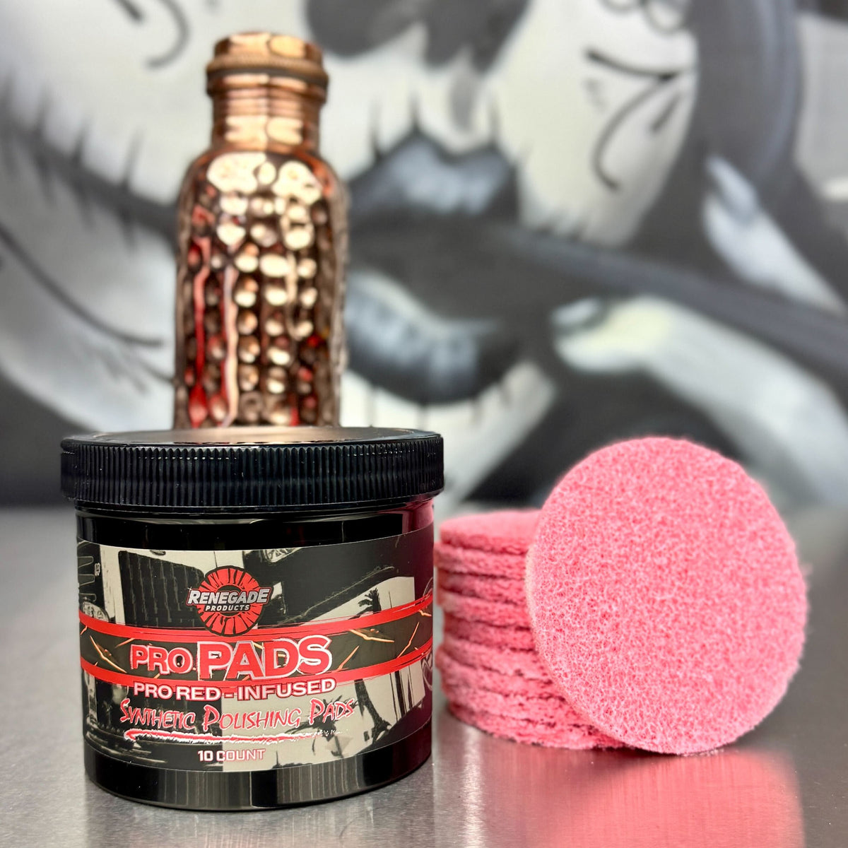 image of renegade pro pads and packaging with a polished bottle in front of a graffiti background