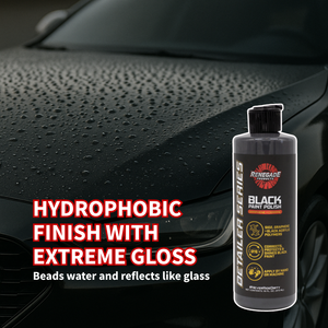 Car with water droplets to display the hydrophobic properties of Renegade Graphene + Ceramic Black Paint Polish on a dark background