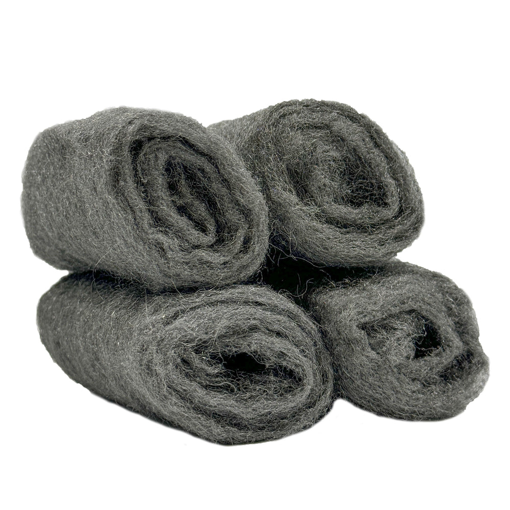 Four rolls of #0000 steel wool for polishing metals and cleaning tire whitewalls, displayed in packaging.