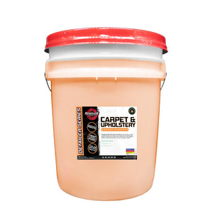 Bottle of Carpet & Upholstery Shampoo with labels detailing usage for vehicle interiors, ingredients, and application instructions.