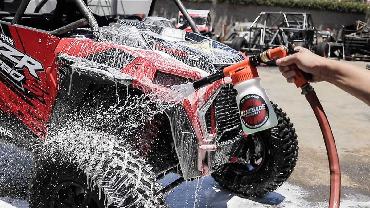 Renegade Hose Foam Gun attached to a standard hose, ready to dispense foam for vehicle cleaning.