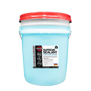 Supreme Sealant Final Finish Sealer bottle with a microfiber pad and towel set on a detailed car surface.